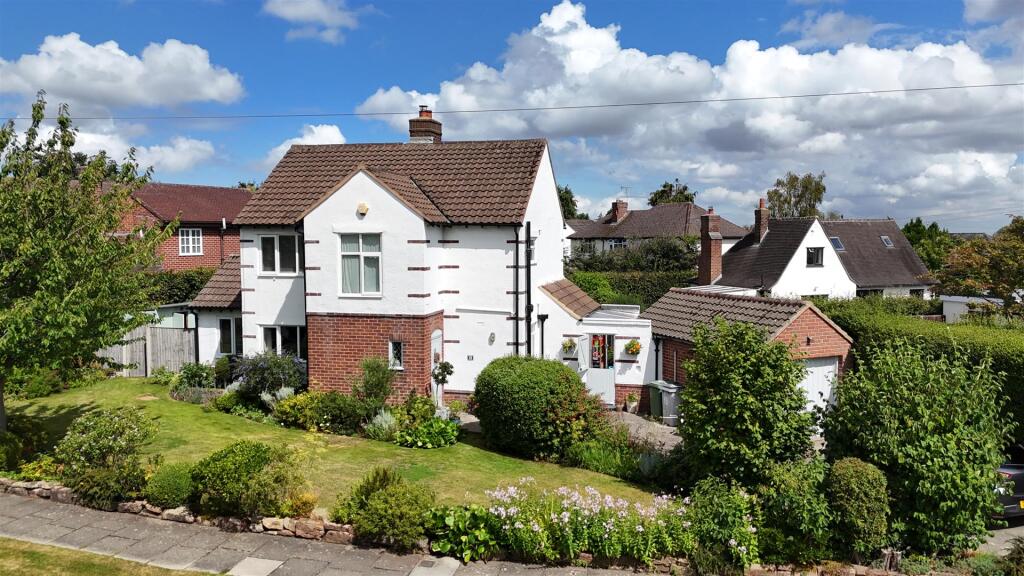 This is a a photograph of the front of 15 Briarfield Road. It was taken on a sunny and at an elevated position from a drone by Hewitt Adams.